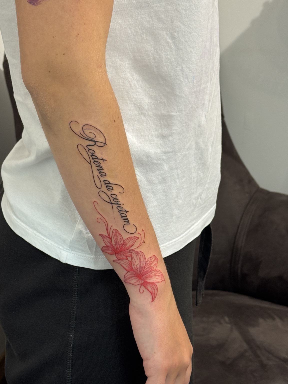 Red lilies tattoo by John Paul Curtis